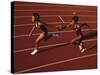 Female Runner Competing in a Relay Track Race-null-Stretched Canvas