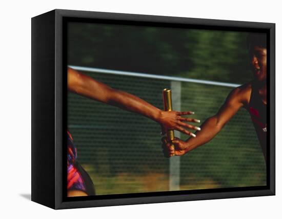 Female Runner Competing in a Relay Track Race-null-Framed Stretched Canvas