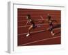 Female Runner Competing in a Relay Track Race-null-Framed Photographic Print