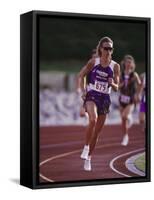 Female Runner Competing in a Track Race-null-Framed Stretched Canvas