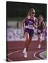 Female Runner Competing in a Track Race-null-Stretched Canvas