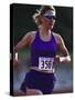 Female Runner Competing in a Track Race-null-Stretched Canvas