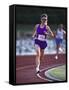 Female Runner Competing in a Track Race-null-Framed Stretched Canvas