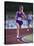 Female Runner Competing in a Track Race-null-Stretched Canvas