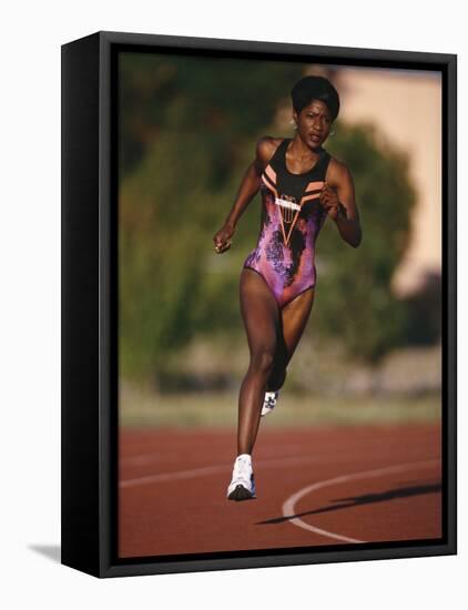 Female Runner Competing in a Track Race-null-Framed Stretched Canvas