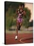 Female Runner Competing in a Track Race-null-Stretched Canvas