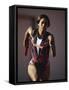 Female Runner Competing in a Track Race-null-Framed Stretched Canvas