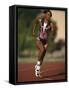 Female Runner Competing in a Track Race-null-Framed Stretched Canvas