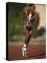 Female Runner Competing in a Track Race-null-Stretched Canvas