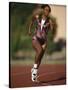 Female Runner Competing in a Track Race-null-Stretched Canvas