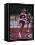 Female Runner Competing in a Track Race-null-Framed Stretched Canvas
