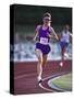 Female Runner Competing in a Track Race-null-Stretched Canvas