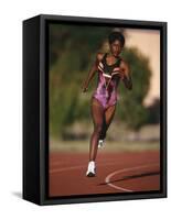 Female Runner Competing in a Track Race-null-Framed Stretched Canvas