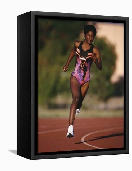 Female Runner Competing in a Track Race-null-Framed Stretched Canvas