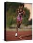 Female Runner Competing in a Track Race-null-Stretched Canvas