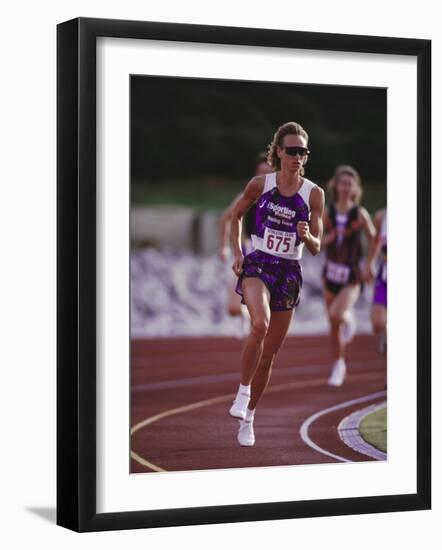 Female Runner Competing in a Track Race-null-Framed Photographic Print