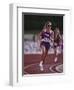 Female Runner Competing in a Track Race-null-Framed Photographic Print