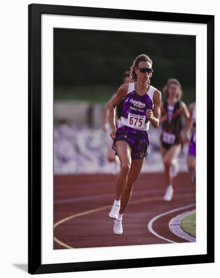 Female Runner Competing in a Track Race-null-Framed Photographic Print