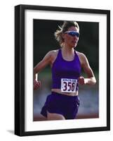 Female Runner Competing in a Track Race-null-Framed Photographic Print