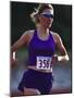 Female Runner Competing in a Track Race-null-Mounted Photographic Print