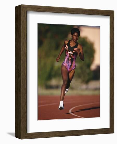 Female Runner Competing in a Track Race-null-Framed Photographic Print