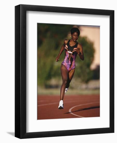 Female Runner Competing in a Track Race-null-Framed Photographic Print