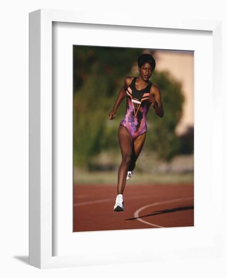 Female Runner Competing in a Track Race-null-Framed Photographic Print