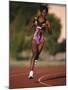 Female Runner Competing in a Track Race-null-Mounted Photographic Print