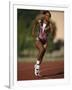 Female Runner Competing in a Track Race-null-Framed Photographic Print