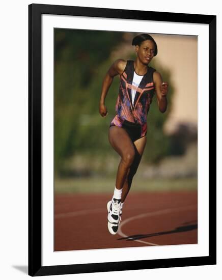 Female Runner Competing in a Track Race-null-Framed Photographic Print