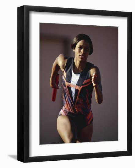 Female Runner Competing in a Track Race-null-Framed Photographic Print