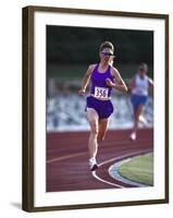 Female Runner Competing in a Track Race-null-Framed Photographic Print