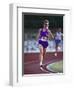 Female Runner Competing in a Track Race-null-Framed Photographic Print