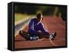 Female Runner Stretching While Training on the Track-null-Framed Stretched Canvas