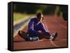 Female Runner Stretching While Training on the Track-null-Framed Stretched Canvas