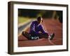 Female Runner Stretching While Training on the Track-null-Framed Photographic Print
