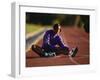 Female Runner Stretching While Training on the Track-null-Framed Photographic Print