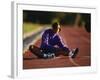 Female Runner Stretching While Training on the Track-null-Framed Photographic Print