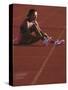 Female Runner Takinfg a Break During Training-null-Stretched Canvas