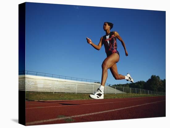 Female Runner Training on the Track-null-Stretched Canvas