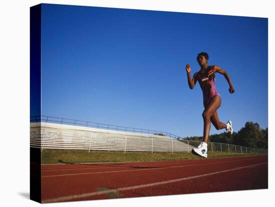 Female Runner Training on the Track-null-Stretched Canvas