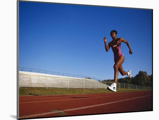 Female Runner Training on the Track-null-Mounted Photographic Print