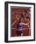 Female Runner Victorious at the Finish Line in a Track Race-null-Framed Premium Photographic Print