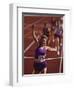 Female Runner Victorious at the Finish Line in a Track Race-null-Framed Premium Photographic Print