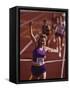 Female Runner Victorious at the Finish Line in a Track Race-null-Framed Stretched Canvas