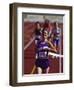 Female Runner Victorious at the Finish Line in a Track Race-null-Framed Photographic Print