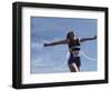 Female Runner Victorious at the Finish Line in a Track Race-null-Framed Photographic Print