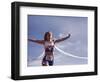 Female Runner Victorious at the Finish Line in a Track Race-null-Framed Photographic Print