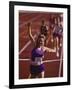 Female Runner Victorious at the Finish Line in a Track Race-null-Framed Photographic Print