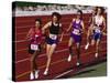 Female Runners Competing in a Track Race-null-Stretched Canvas